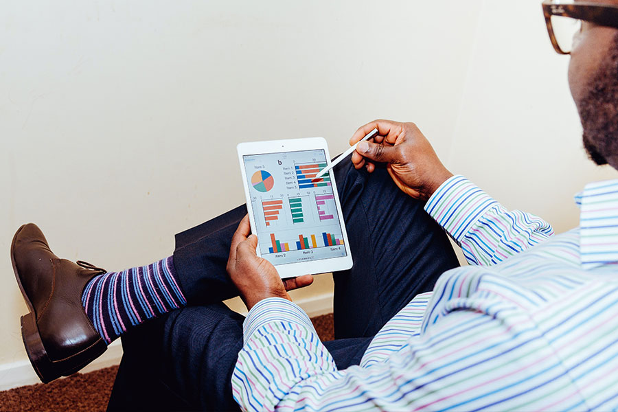 Man Working on Tablet with Stylus